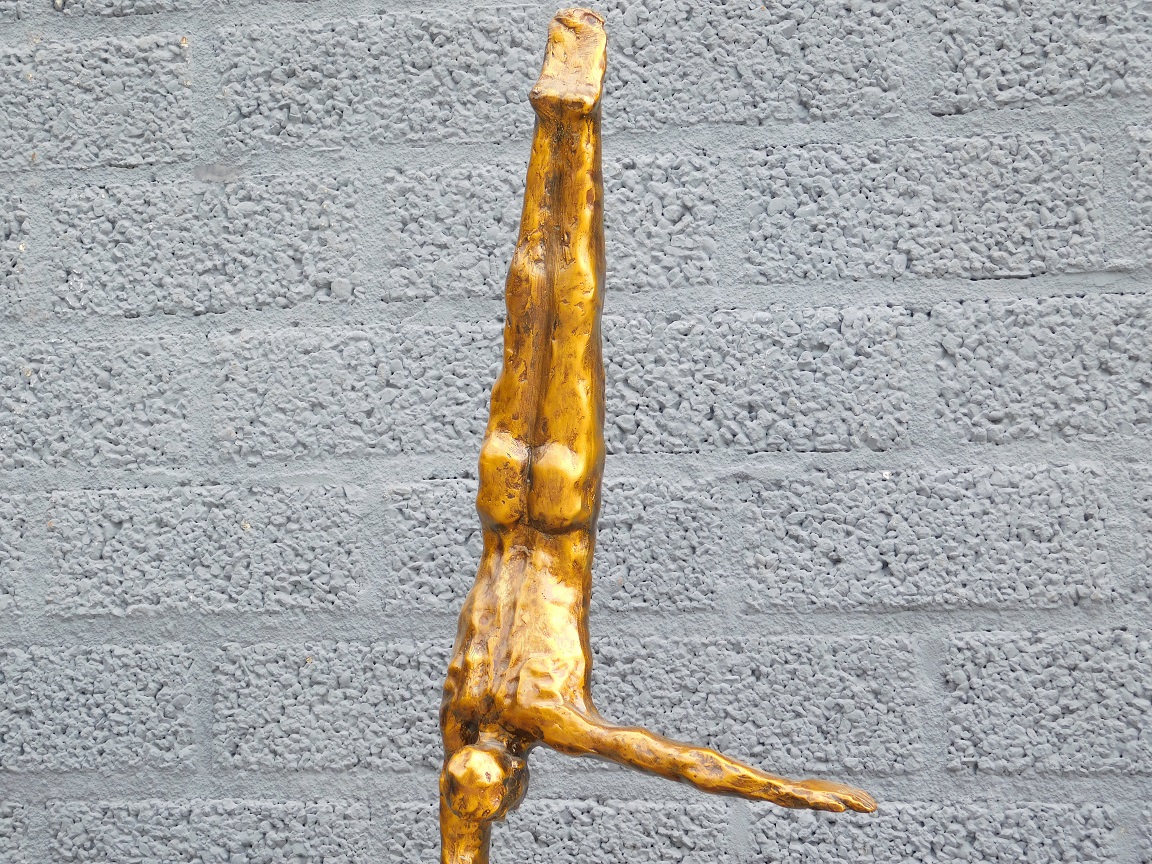 Beeld van een Turner - One Arm Handstand