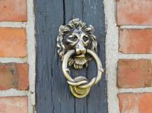 Deurklopper leeuw, antiek ijzer, zwart en messing kleur
