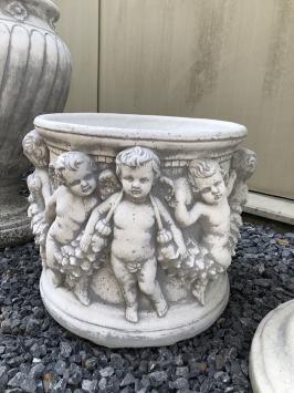 Prachtige zware bloempot-vaas uit vol steen met engelen